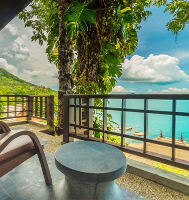 balcony of private villa overlooking a tropical beach